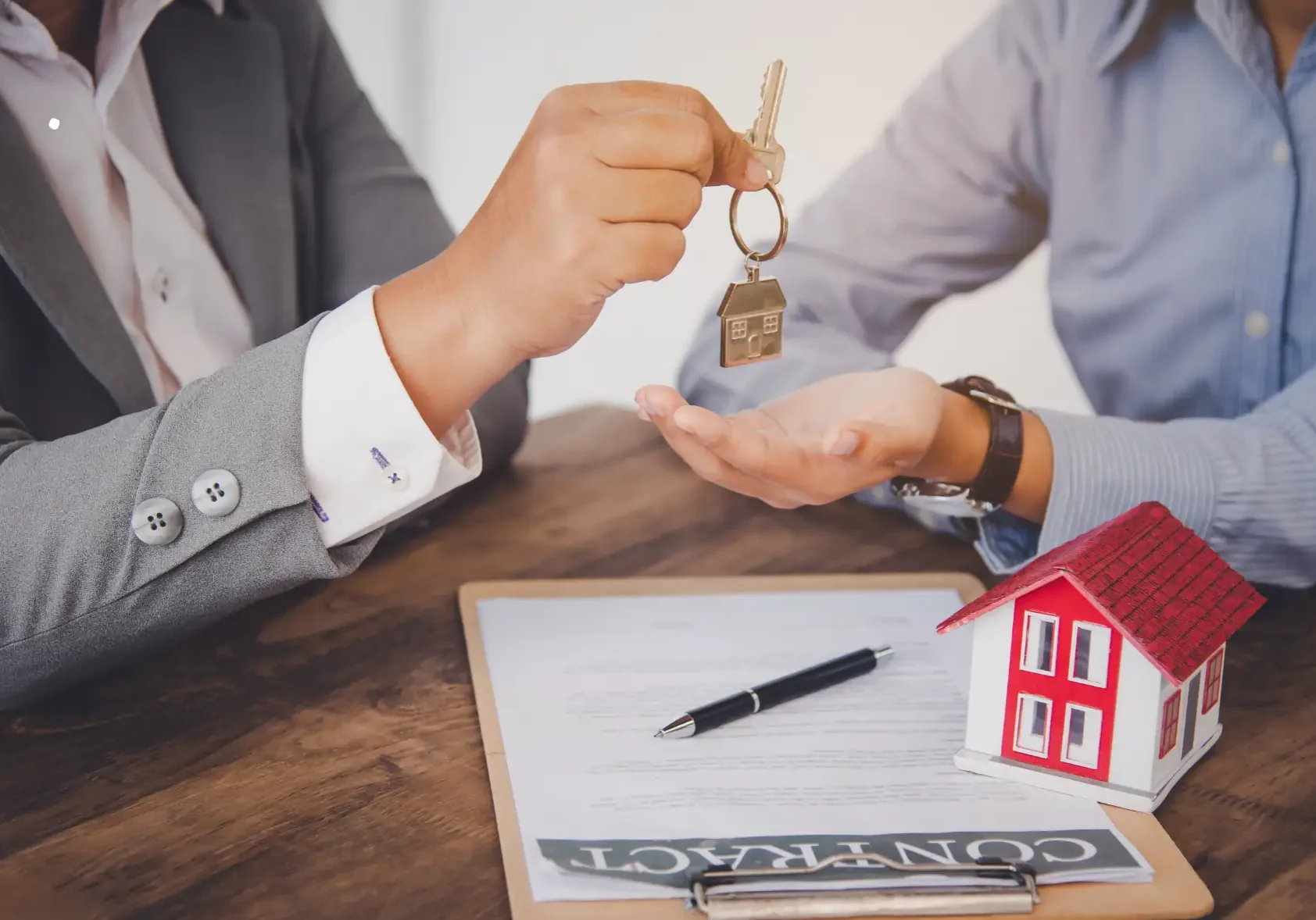 Homeowners negotiating mortgage terms with lender to prevent foreclosure.